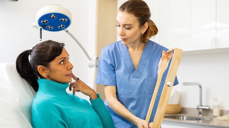 woman talking to esthetician