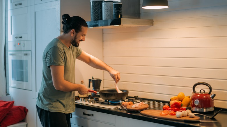 person cooking a meal 