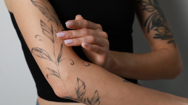 Woman showing off her tattoo