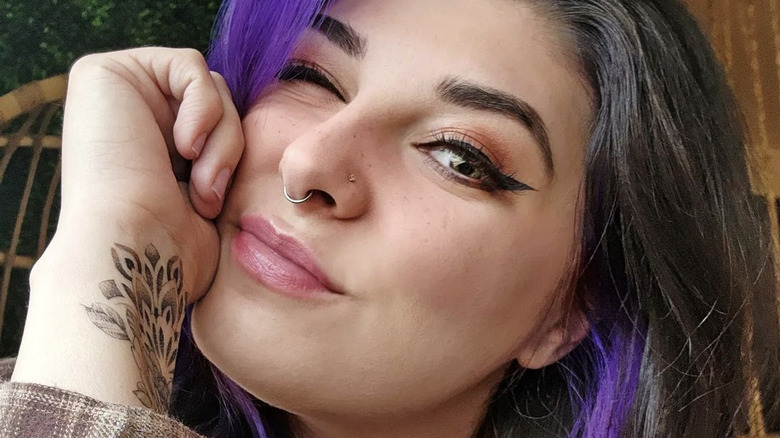 Woman with a standard septum piercing