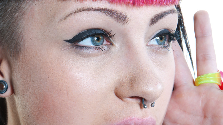 Woman with barbell septum ring