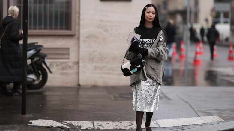 woman wearing midi sequined skirt