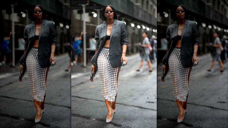 woman wearing open sequined skirt