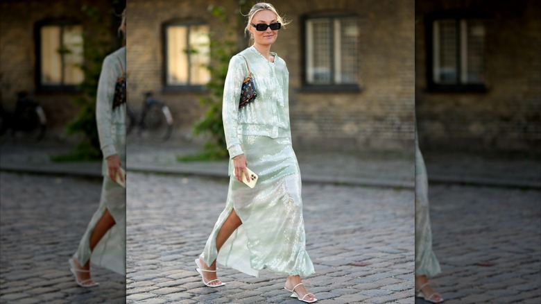 woman wearing sheer sequined skirt