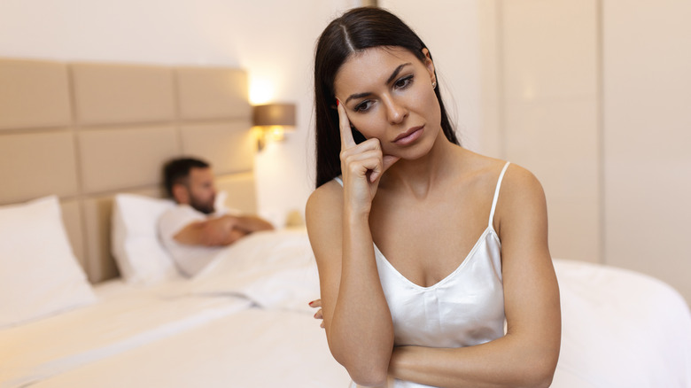 unhappy couple in bedroom