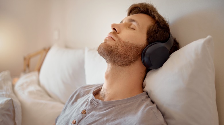 man in bed meditating