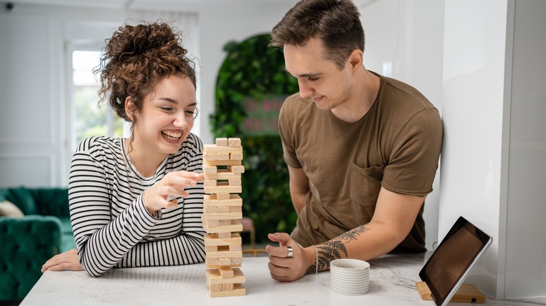 couple playing Jenga together 