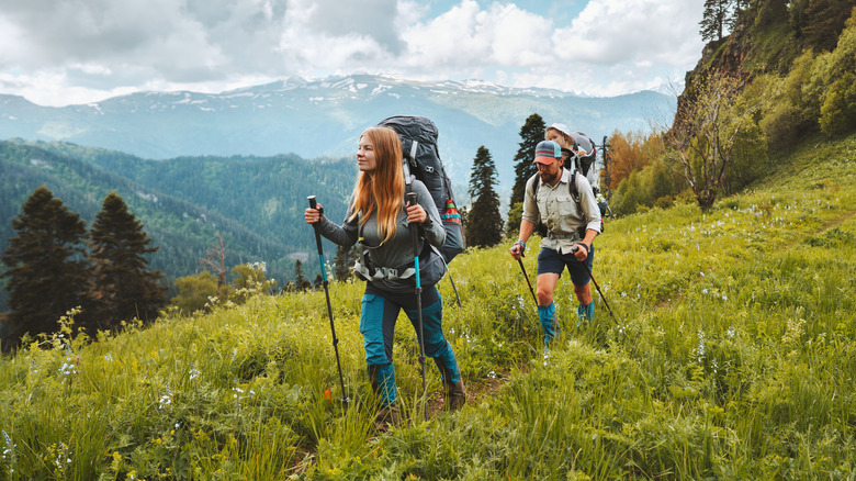 couple hiking together on hillside