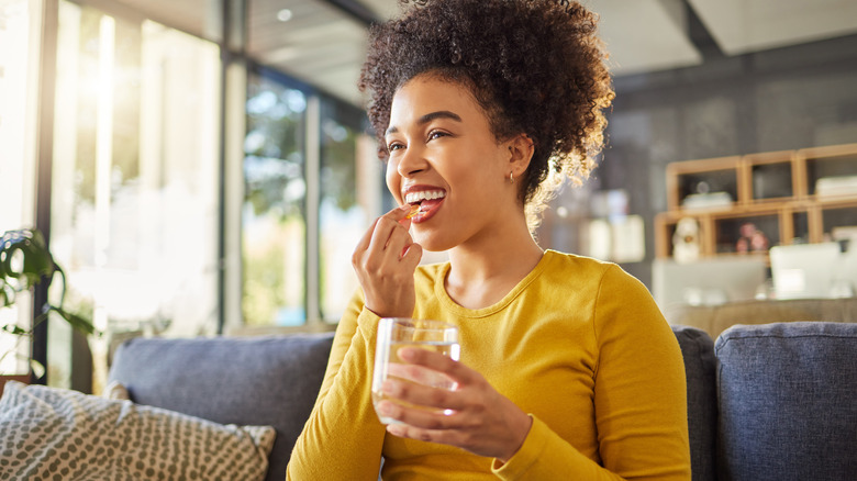 Woman taking medication 