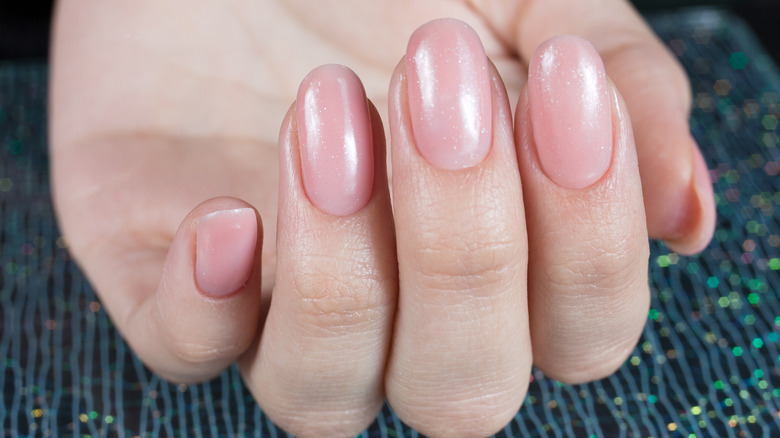 Sheer pink nails with glitter