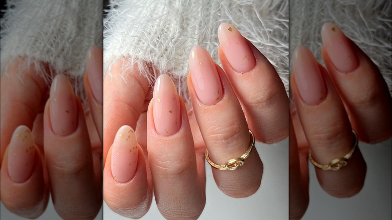 Sheer nude nails with gold flakes