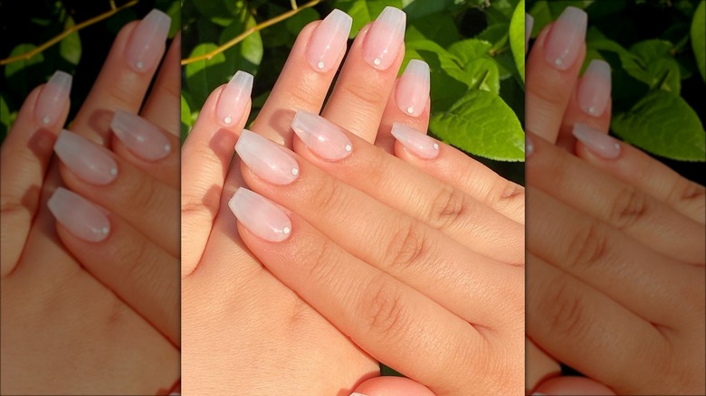 Sheer white nails with gems