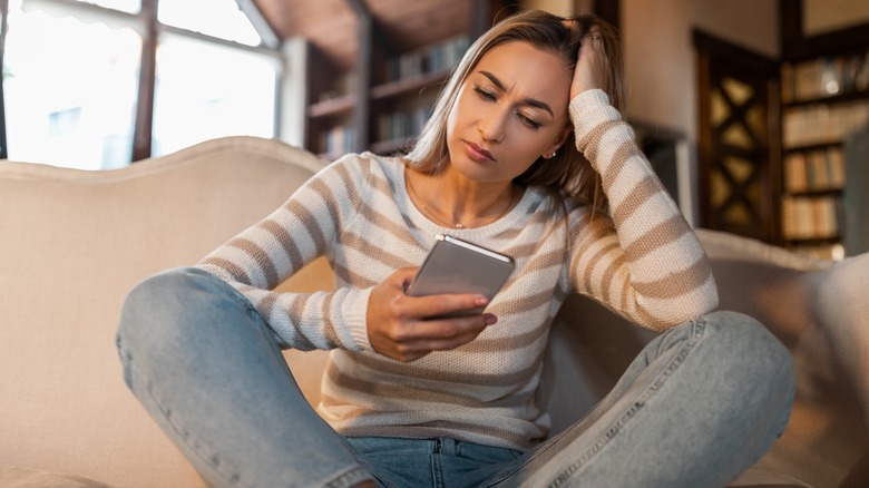 Stressed woman with phone