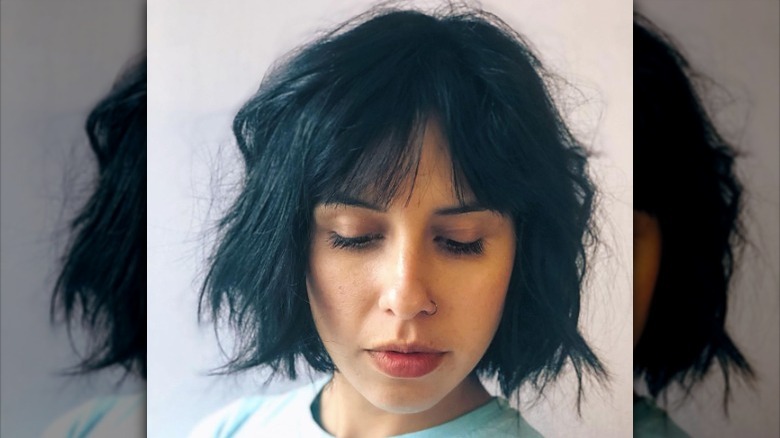 Woman with layered, choppy bob