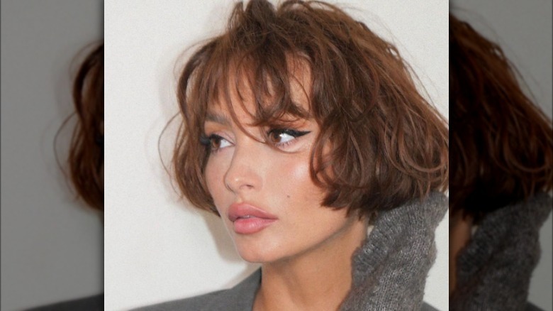 Woman with messy French bob