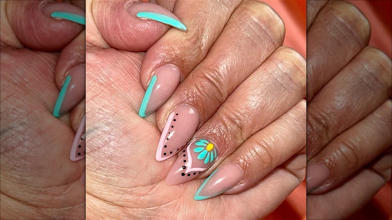 hand with abstract short stiletto nails