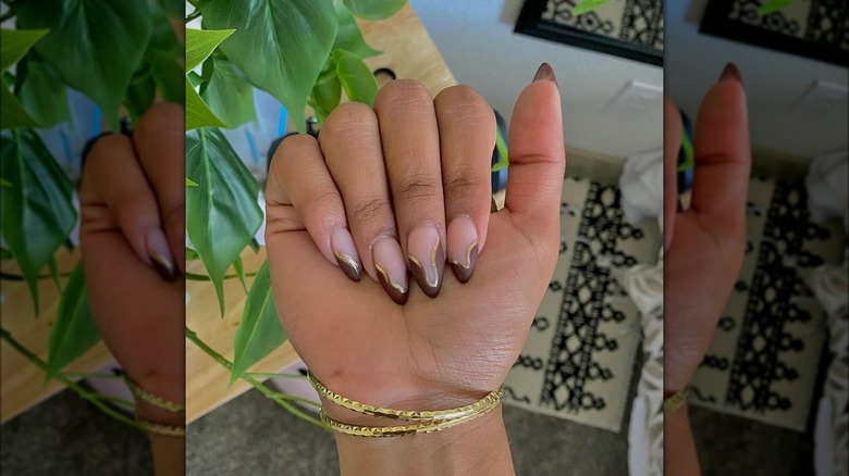 hand with short stiletto french nails