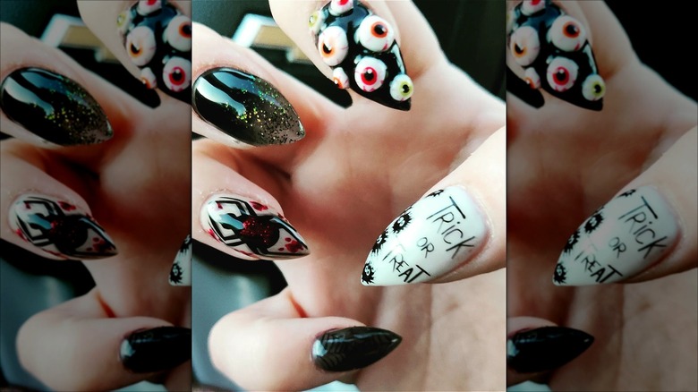 hand with short stiletto halloween nails