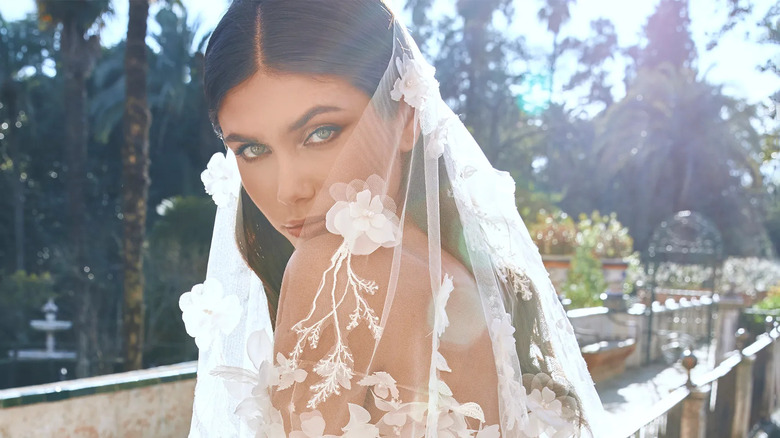 Bride wearing lace veil 