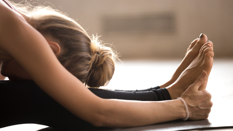 woman doing yoga stretch