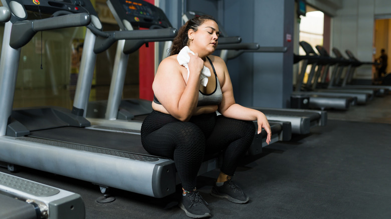 Woman looking tired on the treadmill