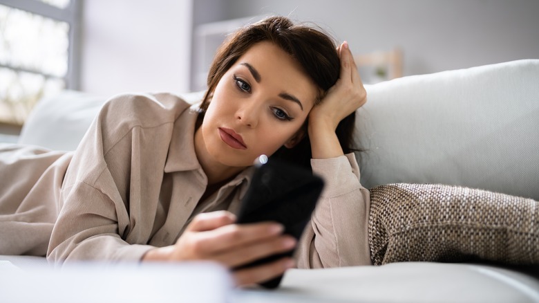 woman looking at phone