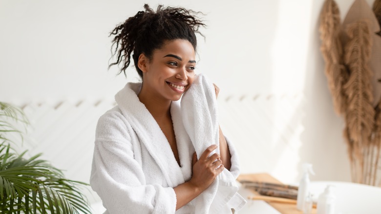 woman towel drying her face