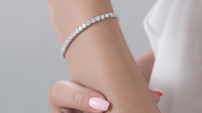 woman's wrist with diamond bracelet