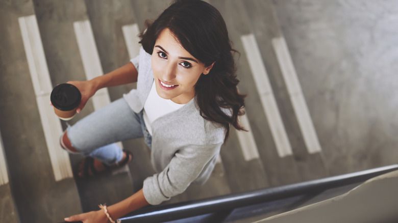 Woman climbing the steps.