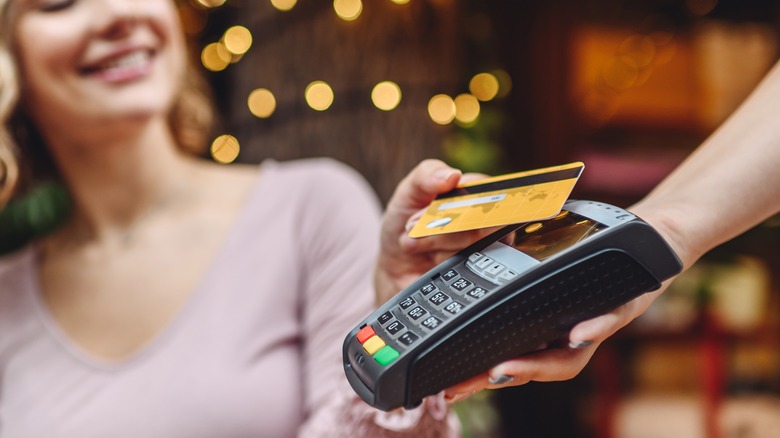 woman making credit card payment 