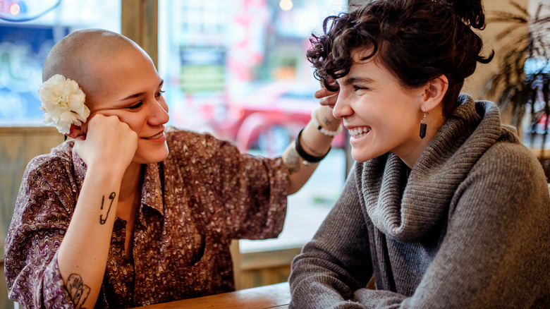 Smiling couple sitting in restaurant