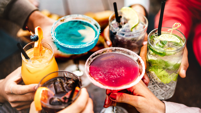 group cheersing their drinks