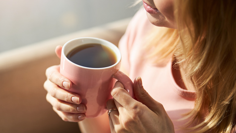 happy woman drinking coffee