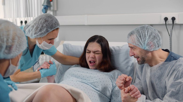 Woman painfully in labor