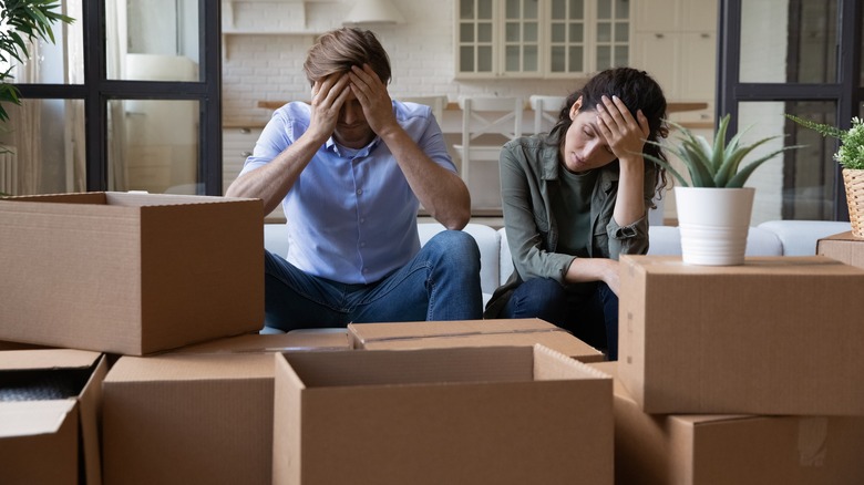 Couple stressed while moving