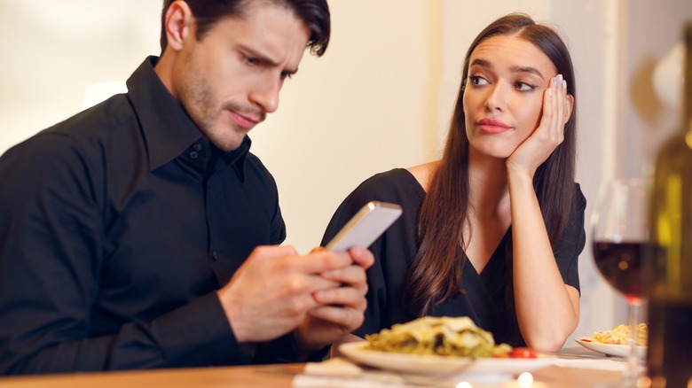 Disconnected couple attends dinner party