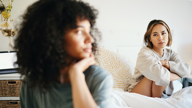 couple arguing in bed