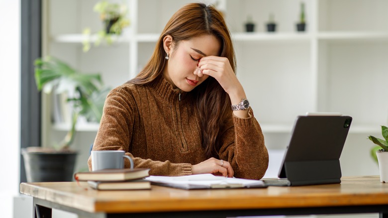 woman thinking at computer