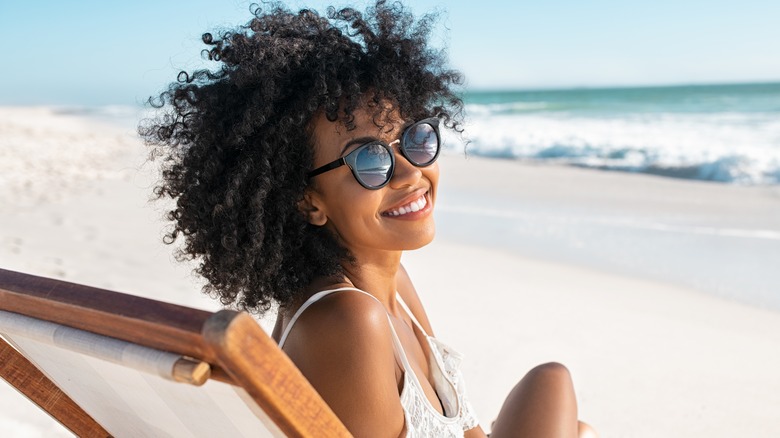 happy woman alone at the beach