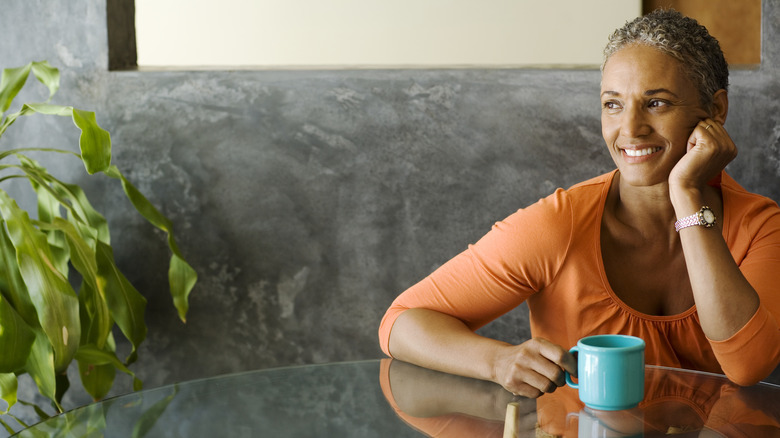 woman smiling with coffee