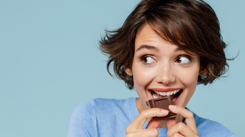 woman eating chocolate