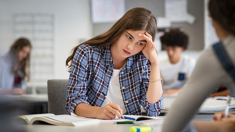 Woman suffering through an exam