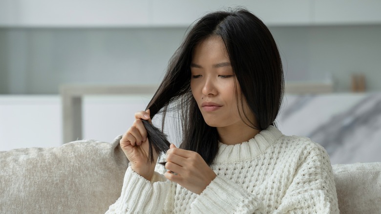 Woman surveying hair loss