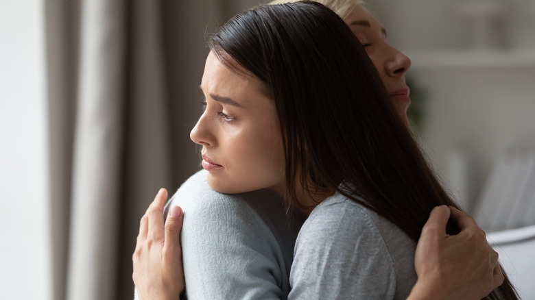 Two women hugging