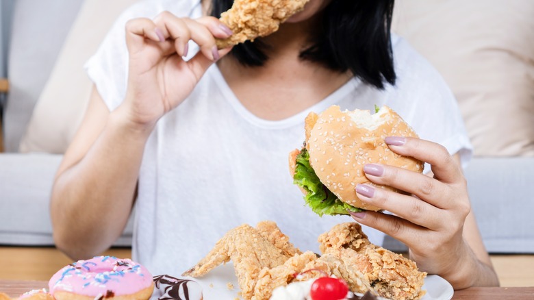 Woman eating junk food