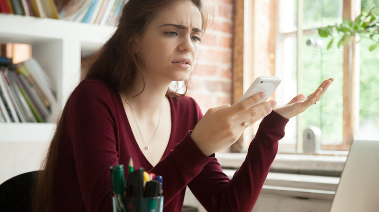 Woman looking grumpy at work