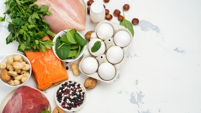 Eggs, nuts, meats, and other sources of protein on table