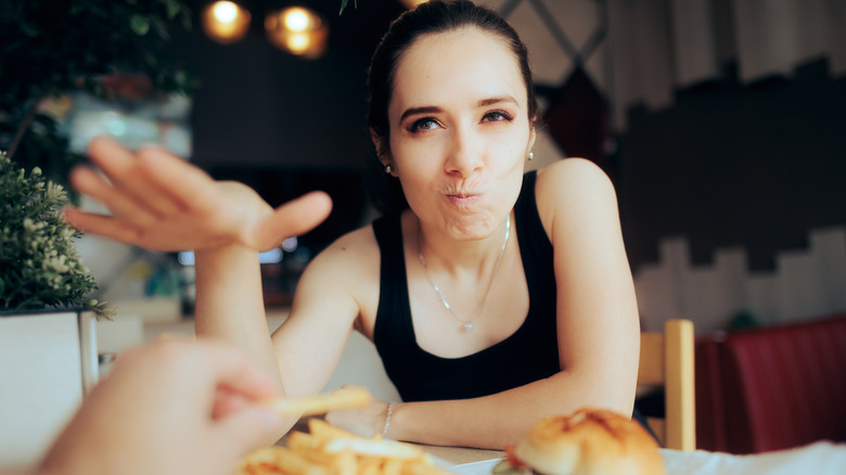 woman not sharing fries