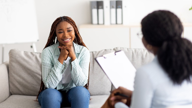 Smiling woman with therapist