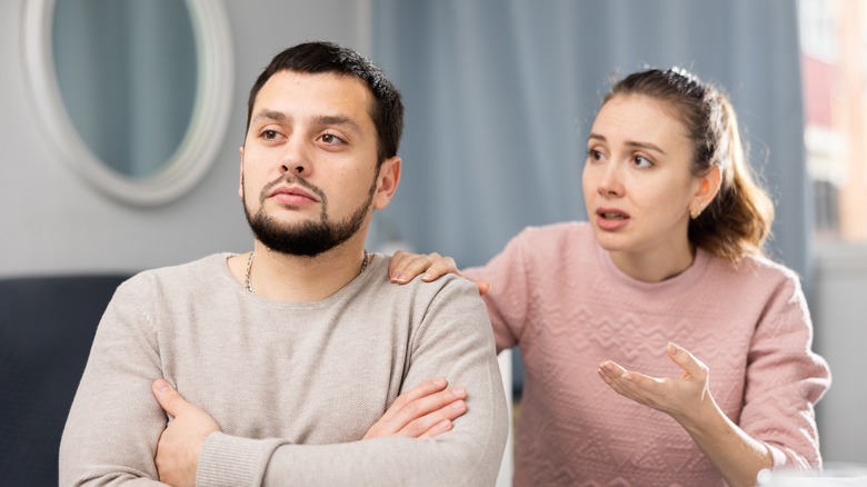 Woman apologizing to offended boyfriend